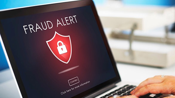 AI Finance Solutions - Laptop showing Fraud Detected