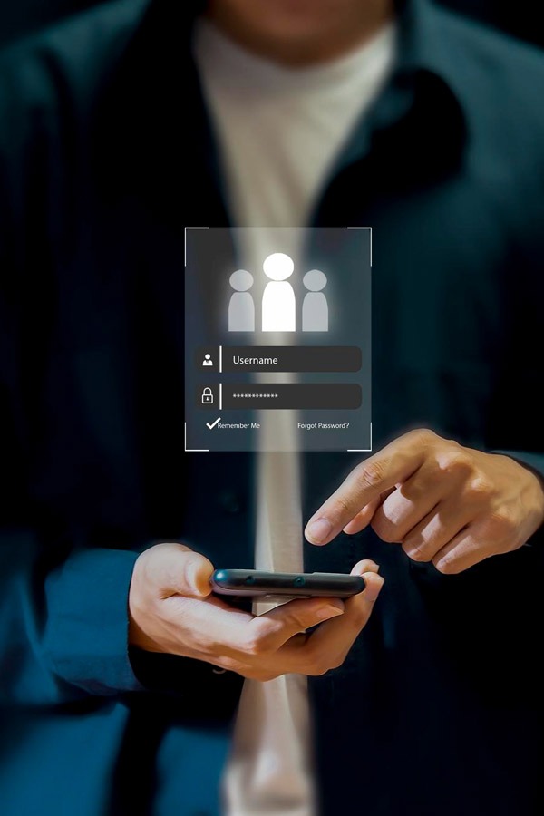 Outcomes and Stakeholders - inclusive digital fs platform - man with smartphone logging in.